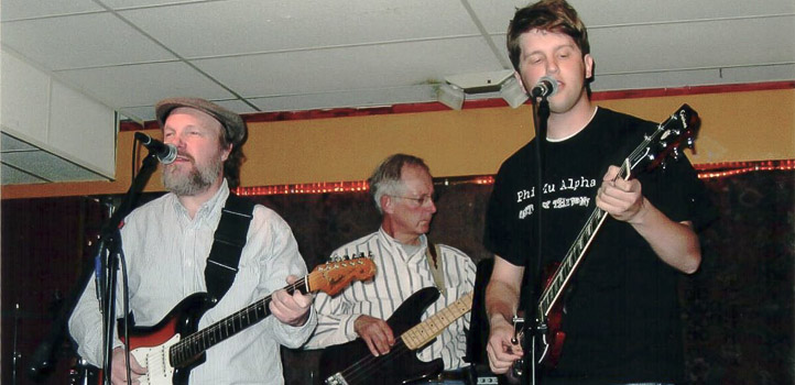 Rich-Dick-John-Mill-Student-Rectial-John-Lake-Music-Lesson-Iowa-City From right, students Rich Gilbaugh and Dick Ahrens, performing with John at the Mill Student Recital, circa 2005